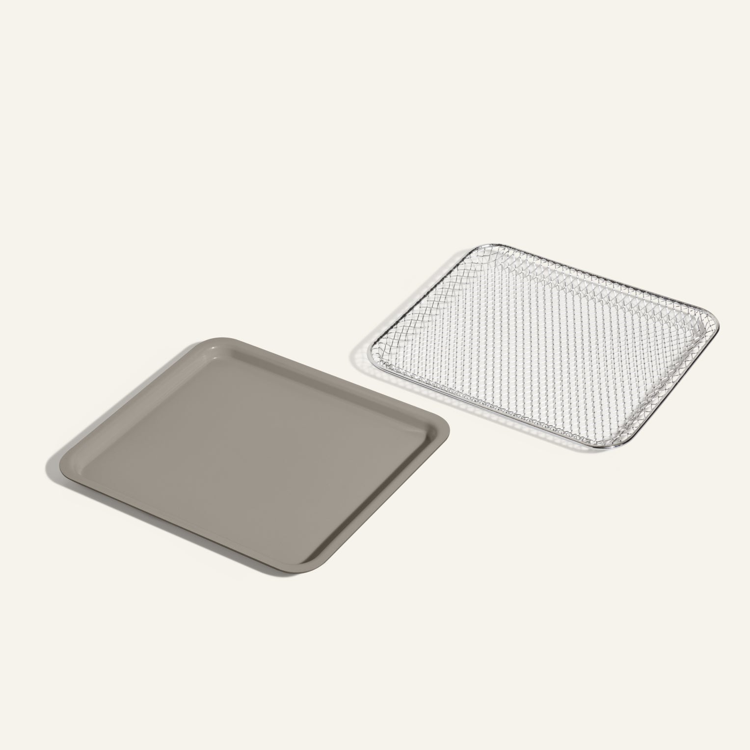 The Wonder Oven Essentials Kit includes a gray rectangular baking tray and matching wire cooling rack—perfect for doubling recipes or expanding your Wonder Oven setup.