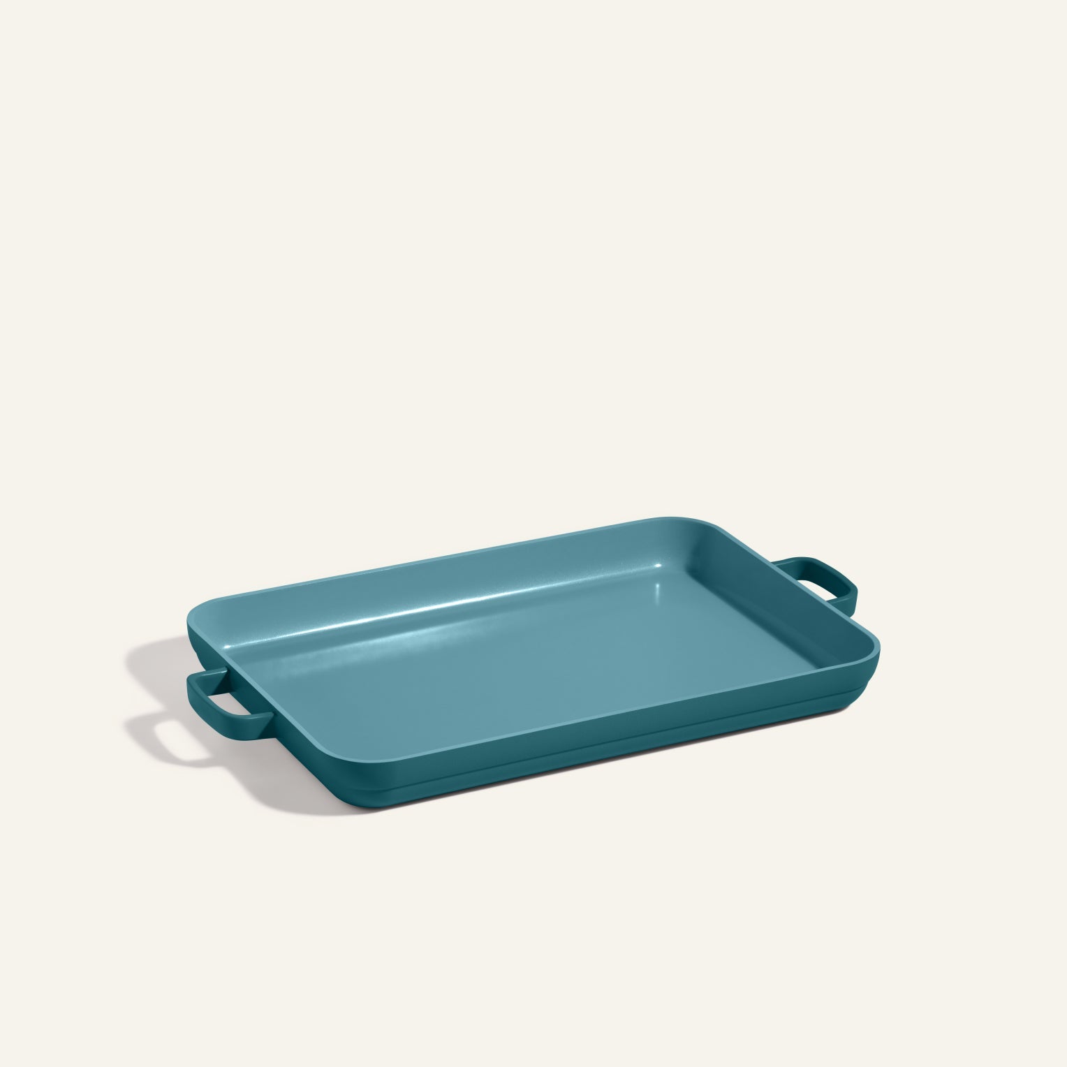 Teal rectangular Griddle Pan with two handles, shown on a plain light background—ideal to pair with your favorite nonstick sheet pan for versatile cooking and easy cleanup.