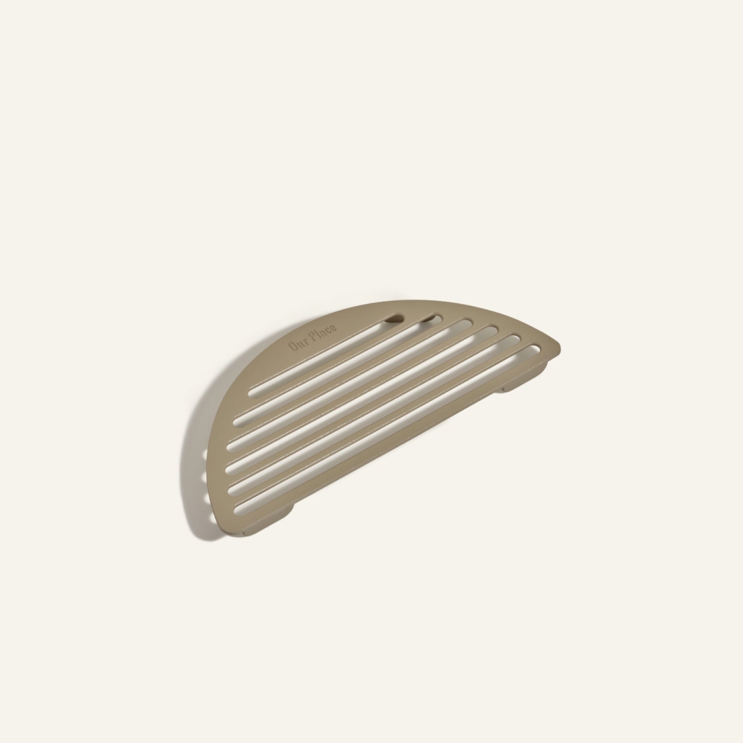 The Fry Deck, a beige semi-circular slotted soap dish with a small edge hole, is shown against an off-white background.