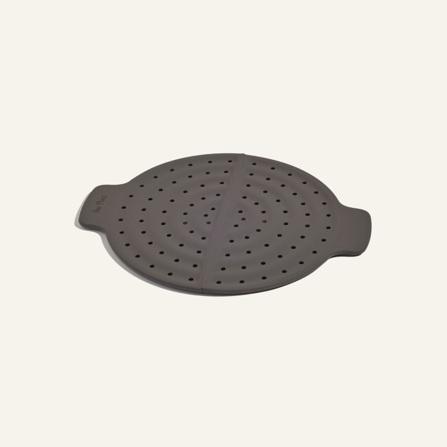 A round, gray silicone lid with handles and small perforations, designed as a microwave or steamer cover to prevent splatters—perfect for your Fearless Fry.