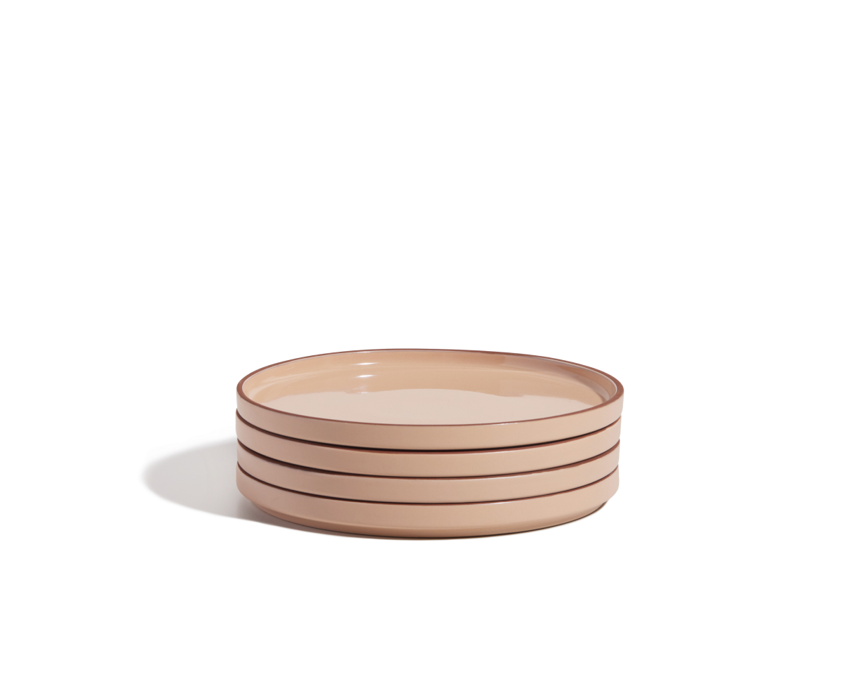 A stack of four beige hand-glazed Salad Plates with brown rims rests on a plain white background, perfect for elevating your tableware collection.