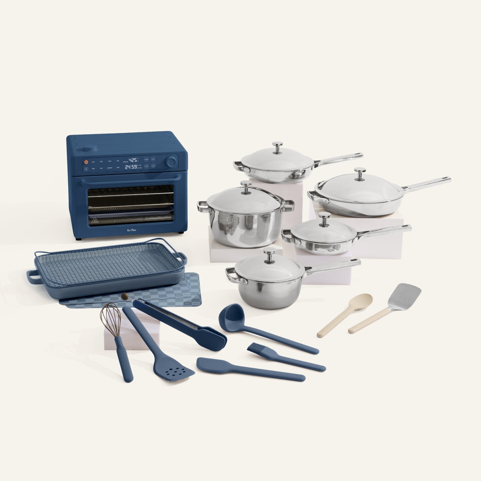 Collection of kitchen appliances and utensils including pots, pans, and cookware on a white background.