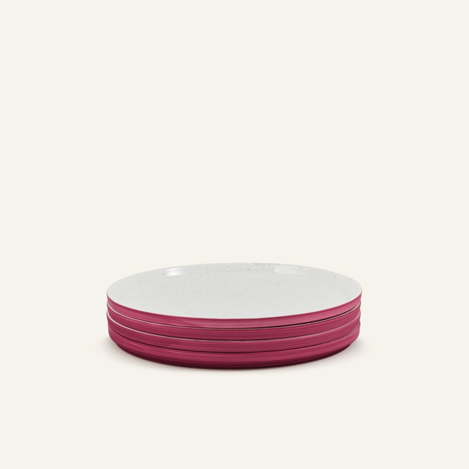 A stack of four Main Plates—porcelain with white tops and pink sides—set against a light background.