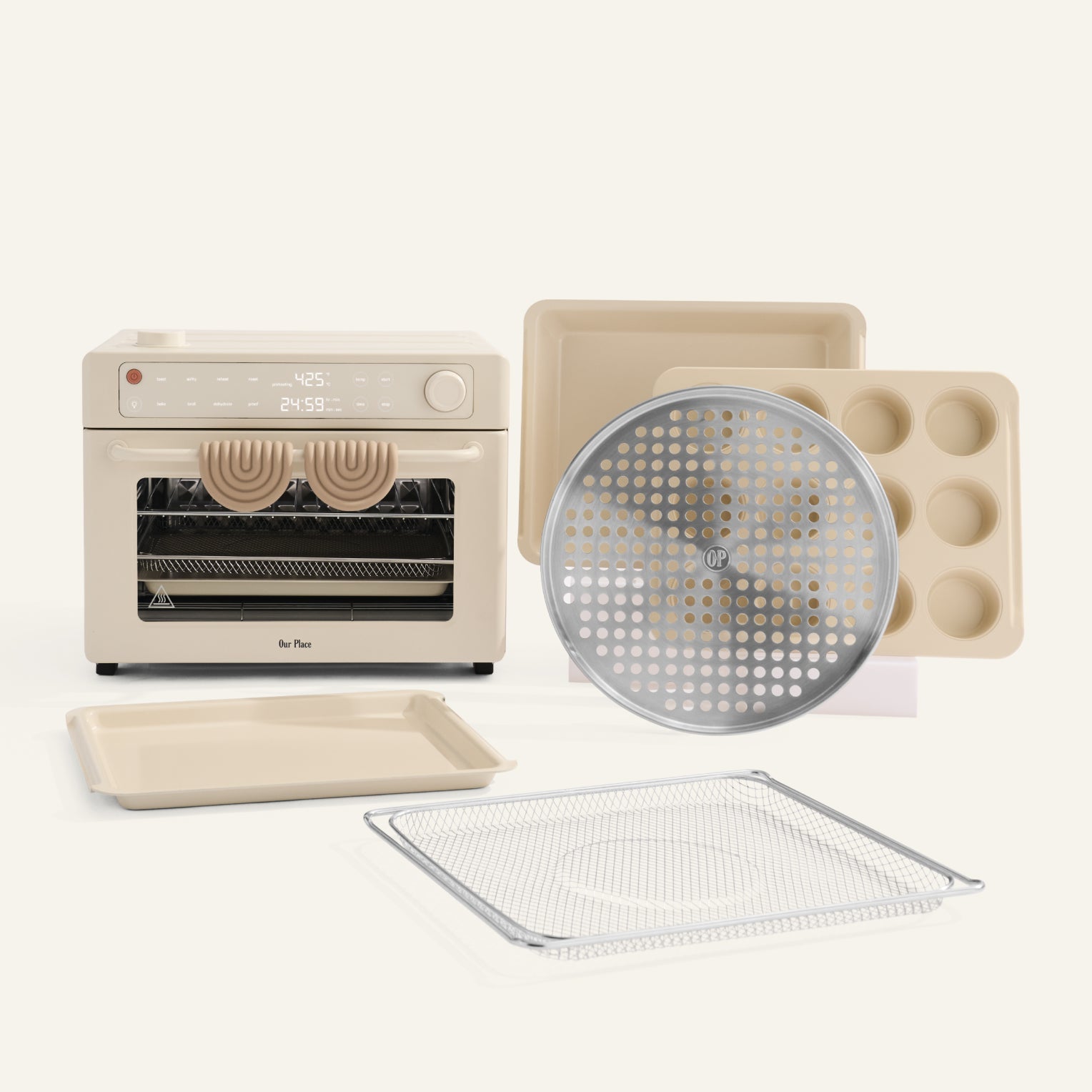 Small oven with various baking trays and accessories on a white background