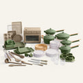 Collection of green kitchenware including pots, pans, and utensils on a white background