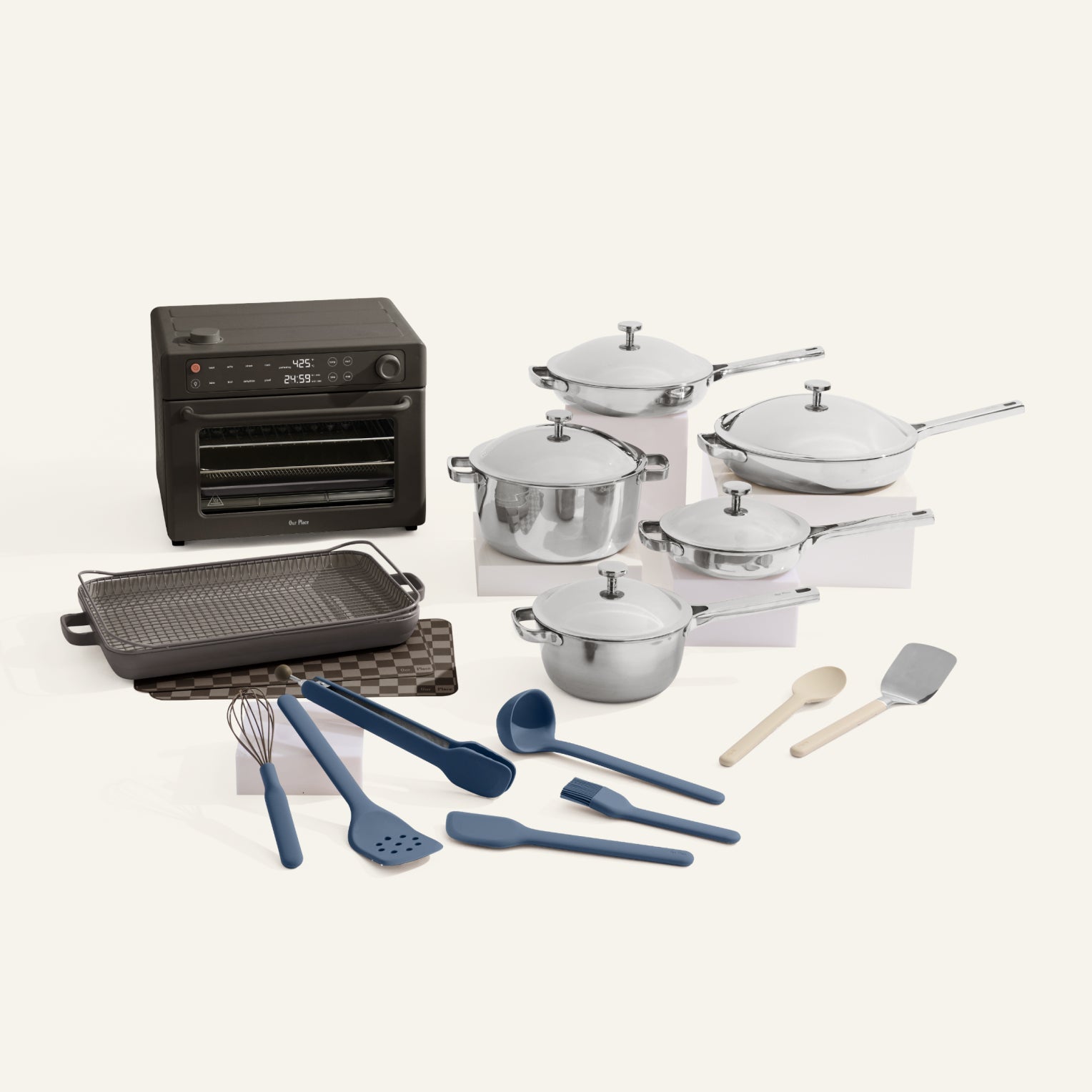 Collection of kitchen appliances and utensils including pots, pans, and cookware on a white background.