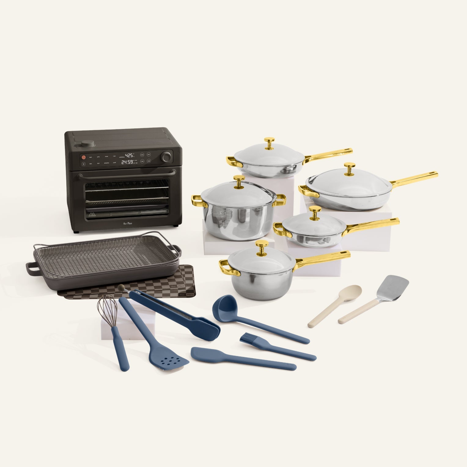 Collection of kitchen appliances and utensils including pots, pans, and cookware on a white background.