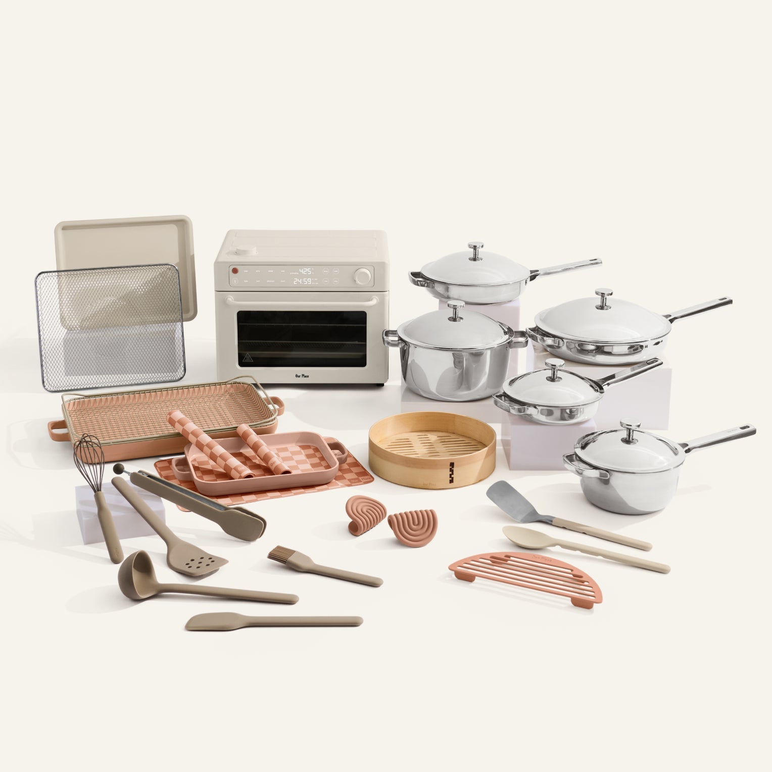 Collection of kitchen utensils and appliances on a white background