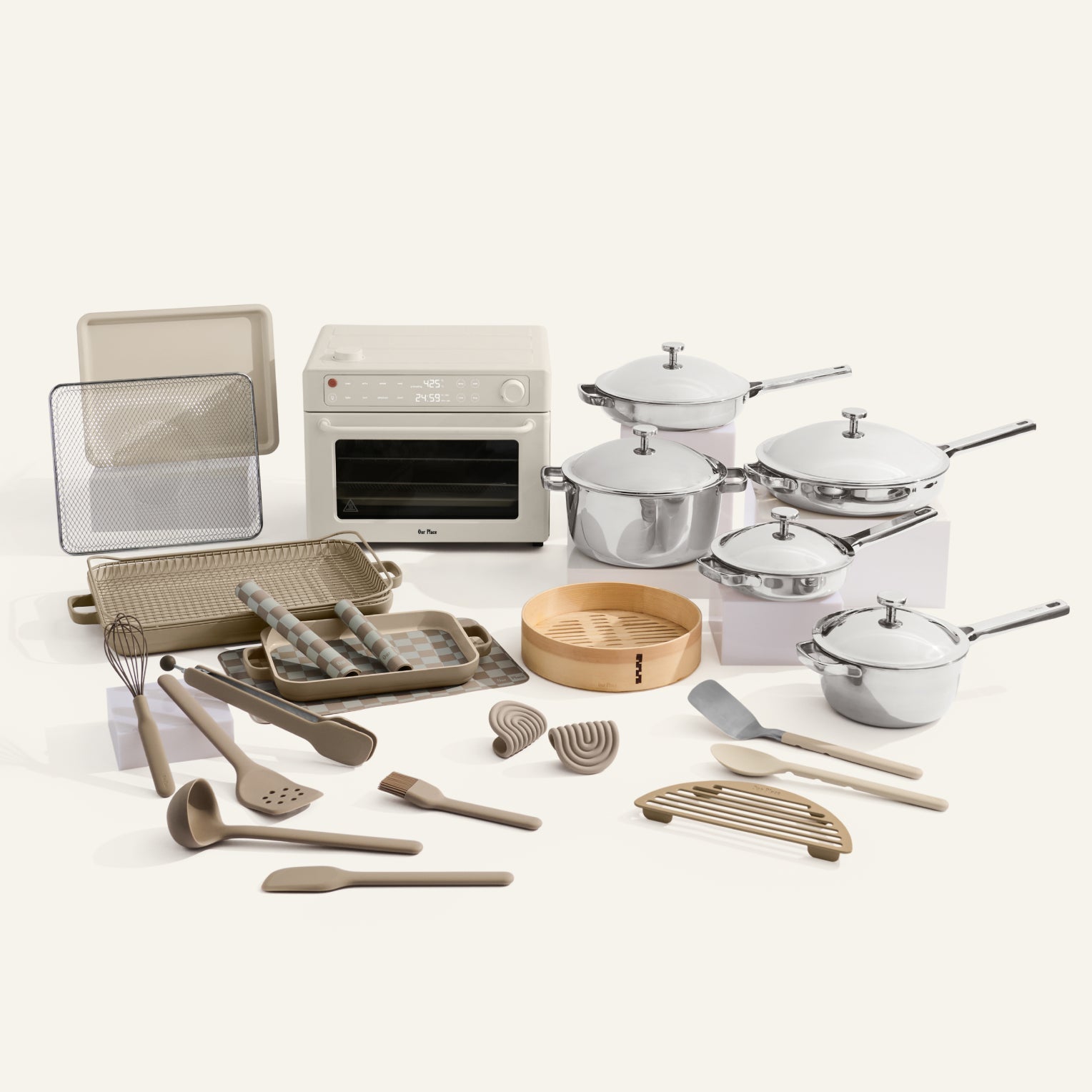 Collection of kitchen utensils and appliances on a white background
