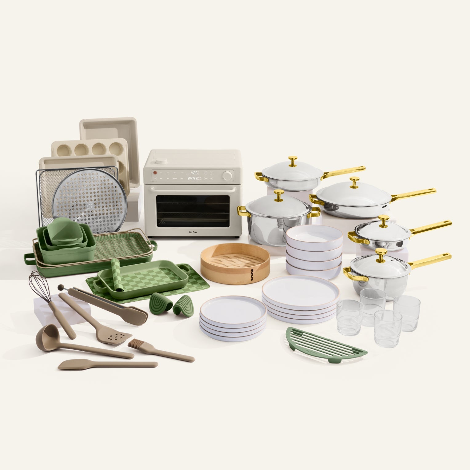 Collection of kitchenware including pots, pans, bowls, and utensils on a white background