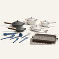 The Home Chef Set (25 piece) features non-toxic pots, pans, a grill pan, baking sheet, and assorted blue and beige cooking utensils arranged on a white background.