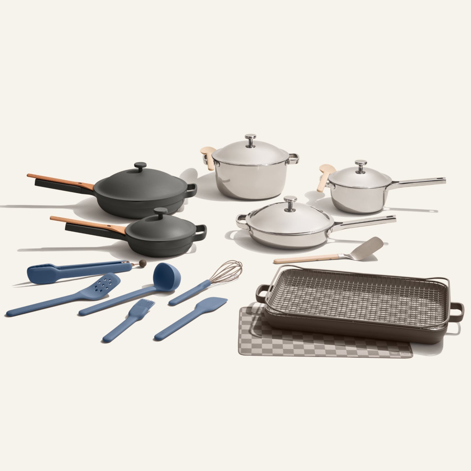 The Home Chef Set (25 piece) features non-toxic pots, pans, a grill pan, baking sheet, and assorted blue and beige cooking utensils arranged on a white background.