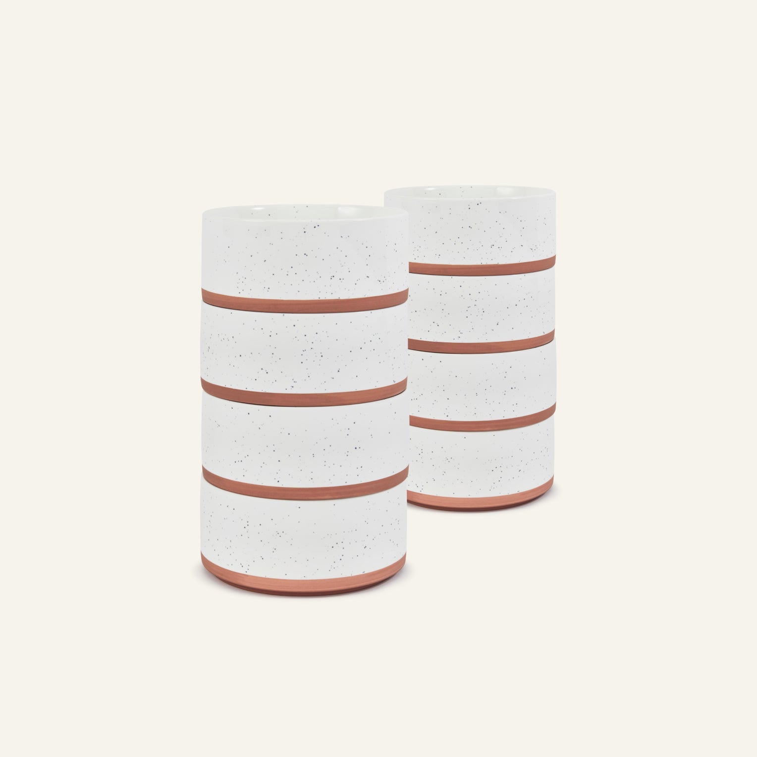 Two Side Bowls with a speckled white ceramic finish and terracotta-colored horizontal bands are positioned side by side on a plain light background.