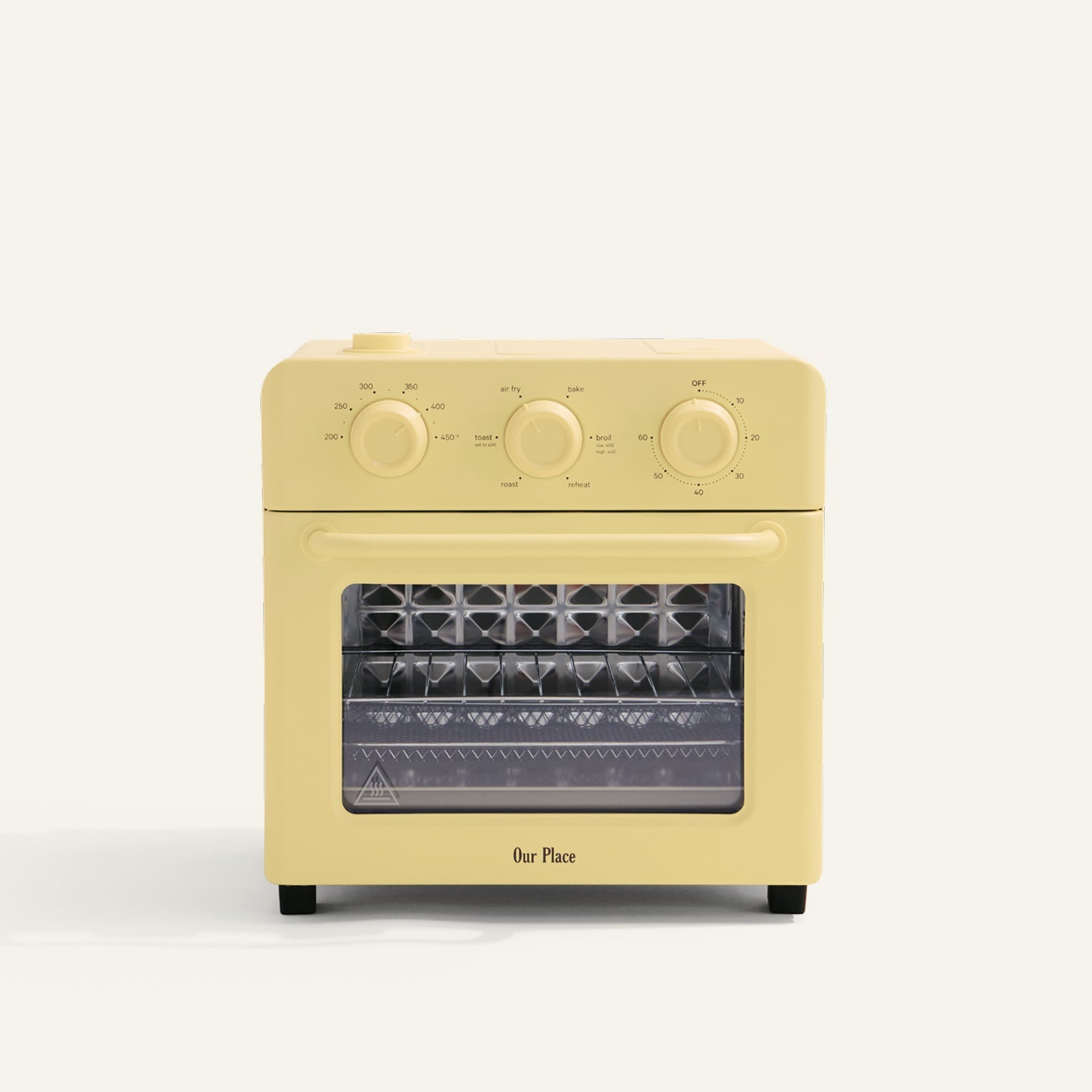 Yellow toaster oven with clear glass door on a white background