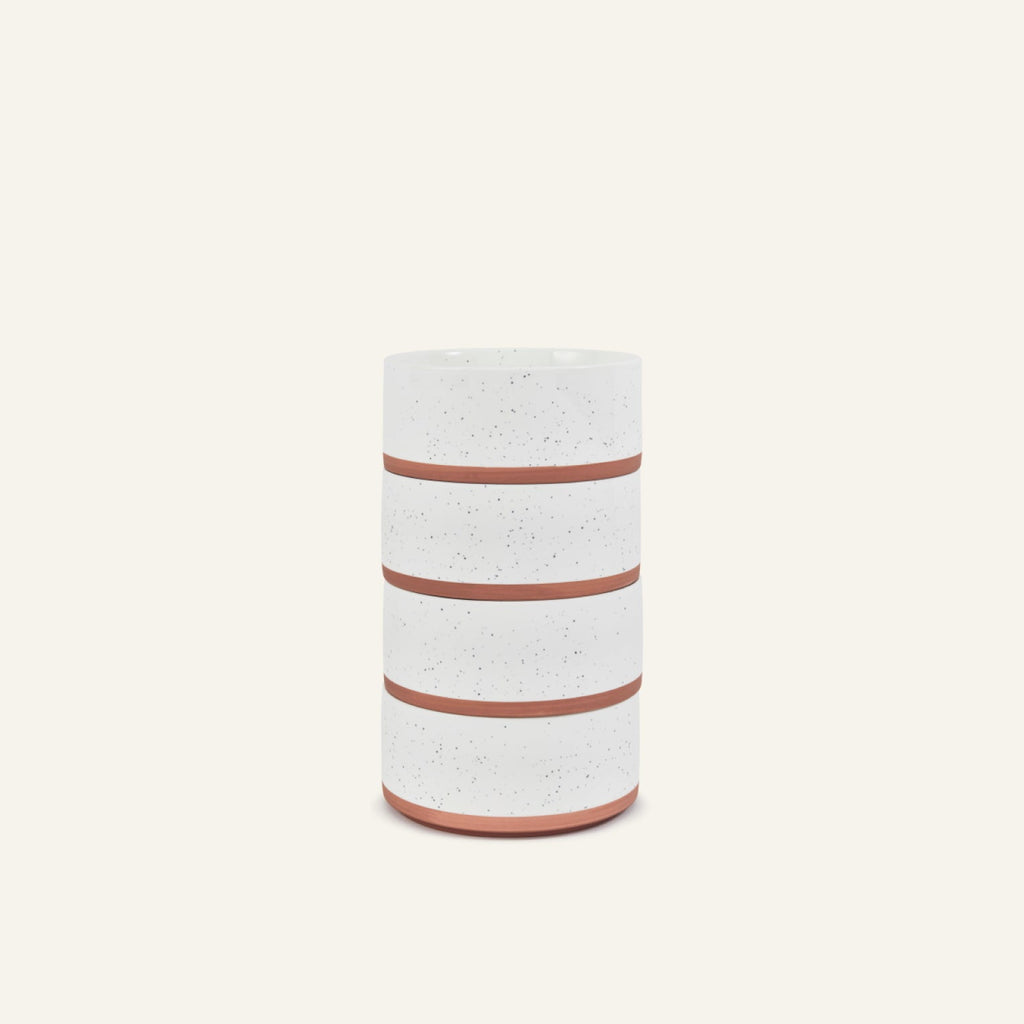 The Side Bowls are cylindrical ceramic containers with a white speckled finish and three horizontal terracotta bands, inspired by elegant soup bowls, displayed upright against a plain light background.